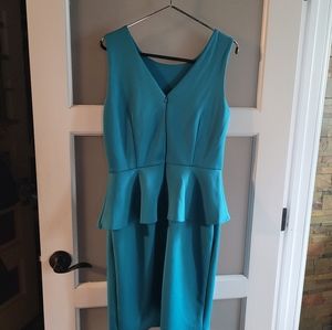 Dress size 8  not worn color Jade. Knee length, polyester blend. Smooth fit.